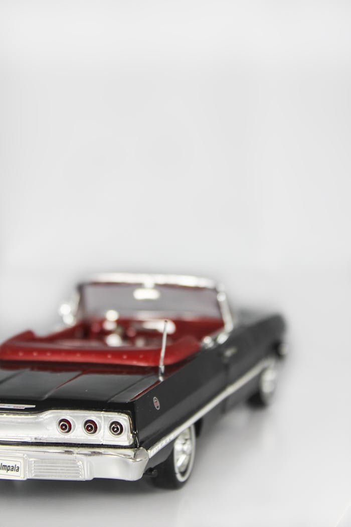 Detailed macro shot of a classic car model toy with a focus on its rear design.